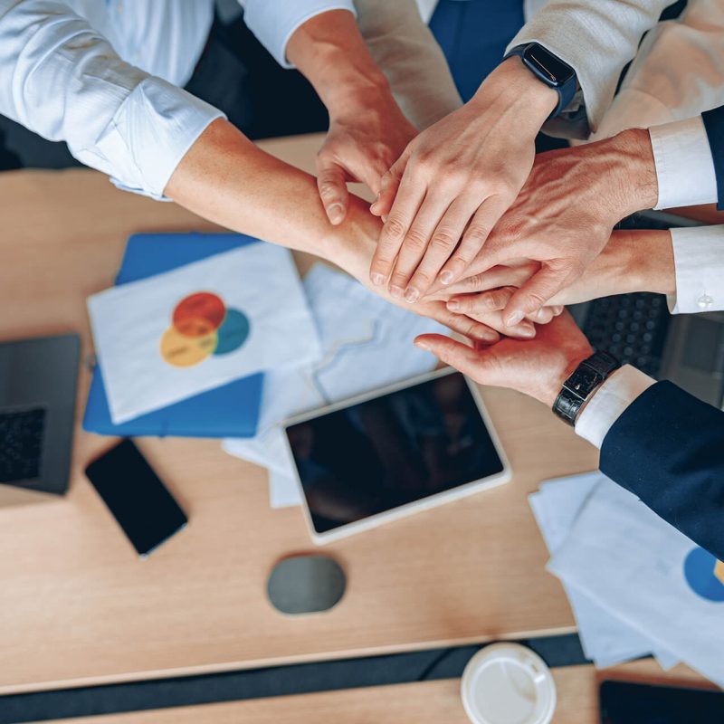 close-up-of-happy-business-team-celebrating-victor-2022-05-02-19-17-58-utc